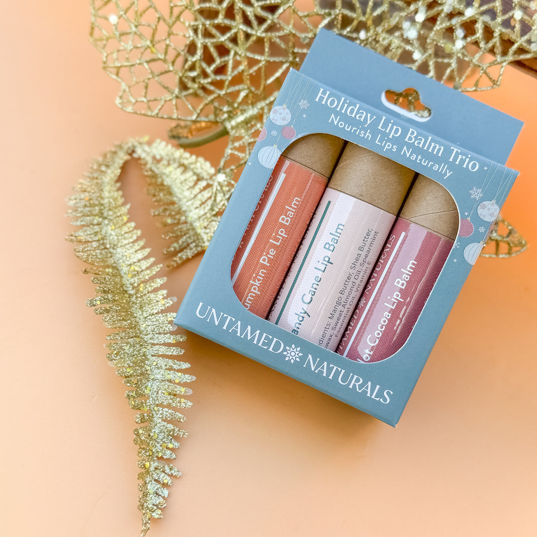 3 holiday lip in balms in a gift set box. Pumpkin spice, hot cocoa and candy cane lip balm